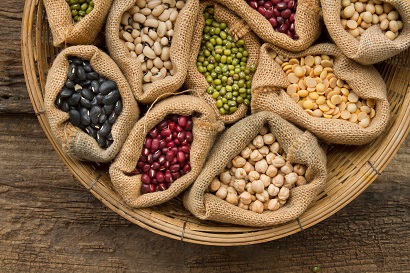 Legumes seed bean in sack bag on wooden background, top view. Dried food, Protein from plant, harvest concept.